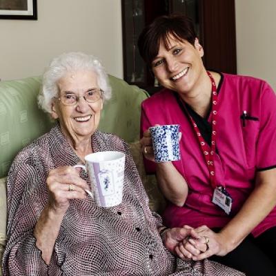 Carer Sally Rutty (on the right) providing care in the home